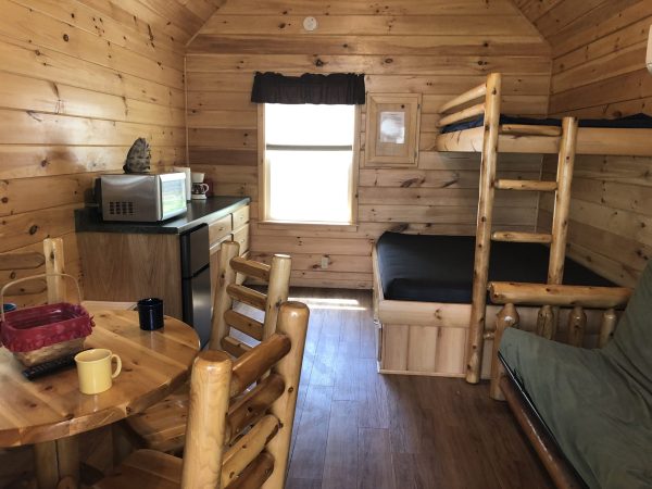 dining and sleeping area in rocky raccoon cabin